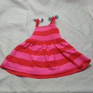 Striped swim top for baby with floral pattern and unique straps, 2005